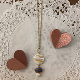 Fish and pearl necklace