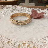 Gold and white bracelet