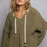 she’s an olive sweater