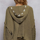 she’s an olive sweater