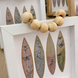 Surfboard framed art by Nicole Miller